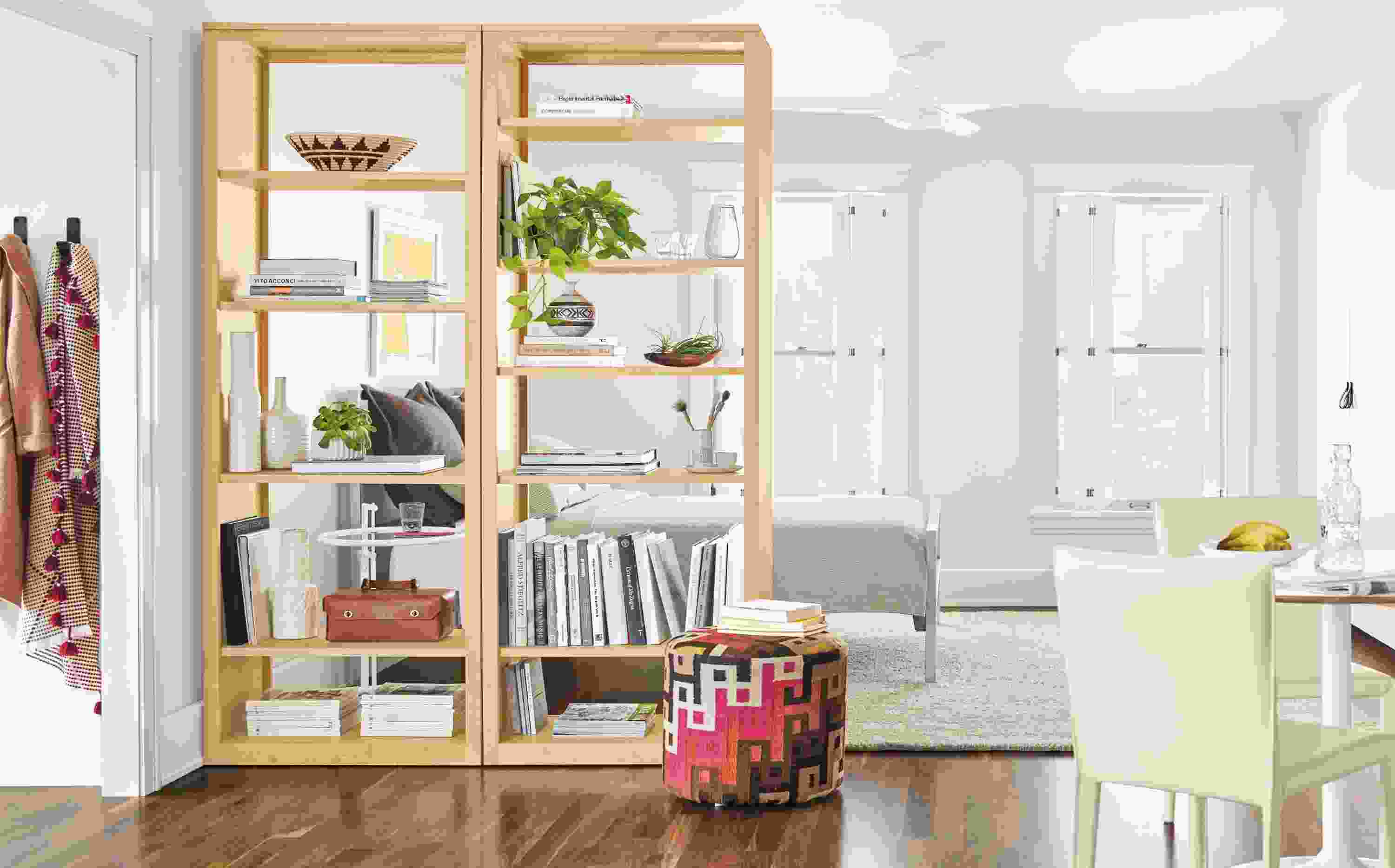 Detail of of Woodwind custom storage cabinet in maple and Aria round table in white in a studio apartment.