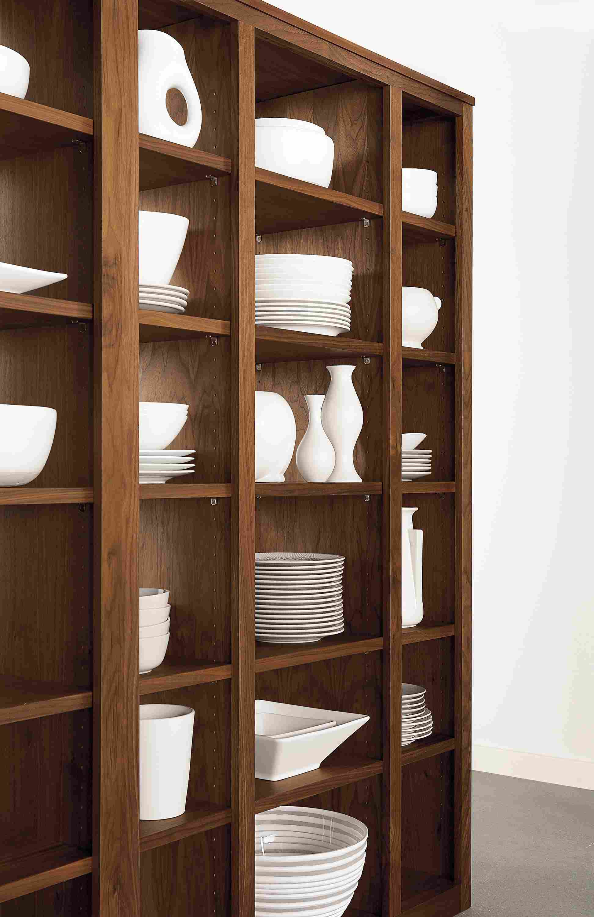 Angled detail of Woodwind 44-wide by 72-high triple open-back bookcase in walnut.