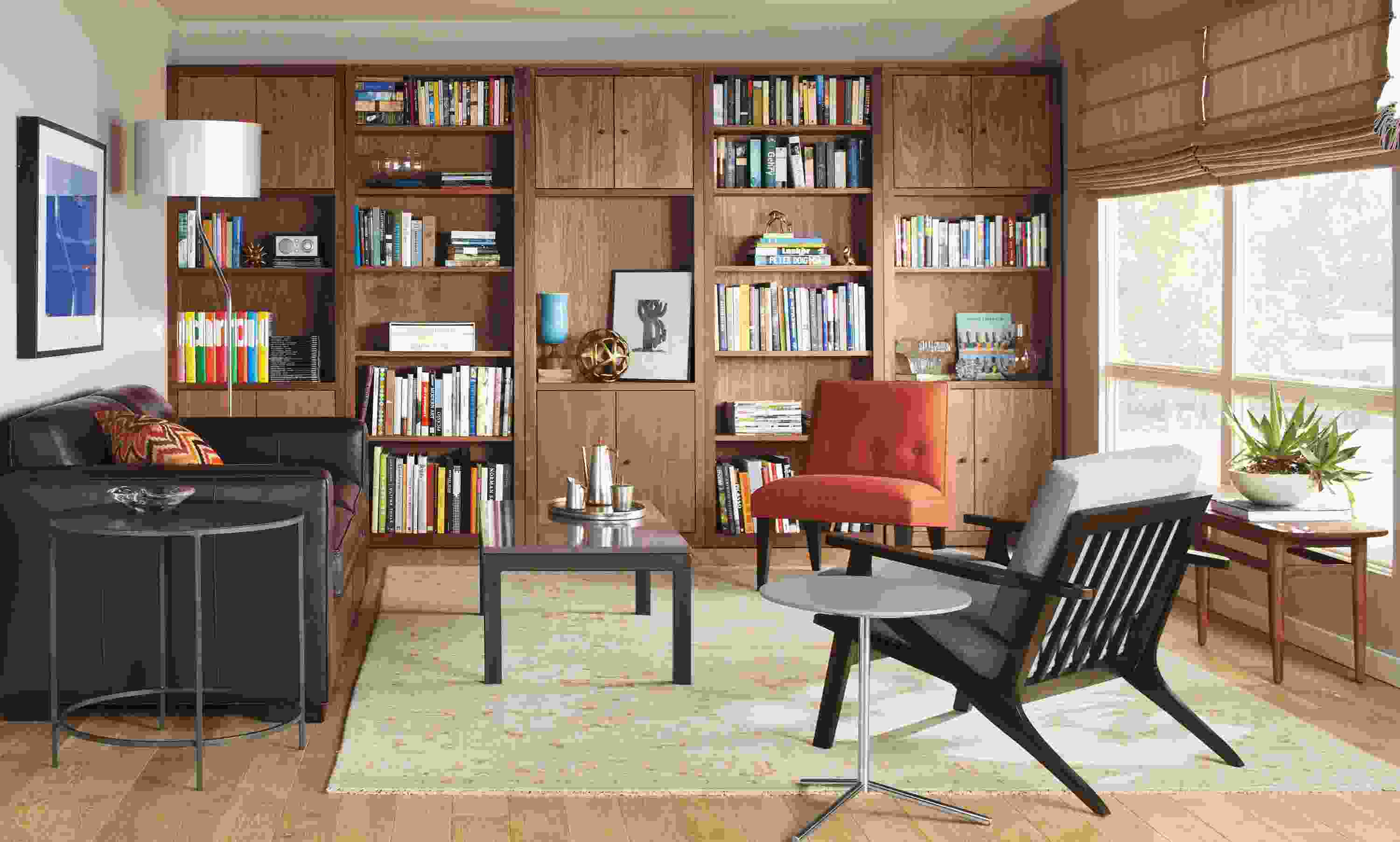 Living room with Woodwind bookcases, Hennepin made bowl, Profile frame, Ian sofa, Sasha lamp.