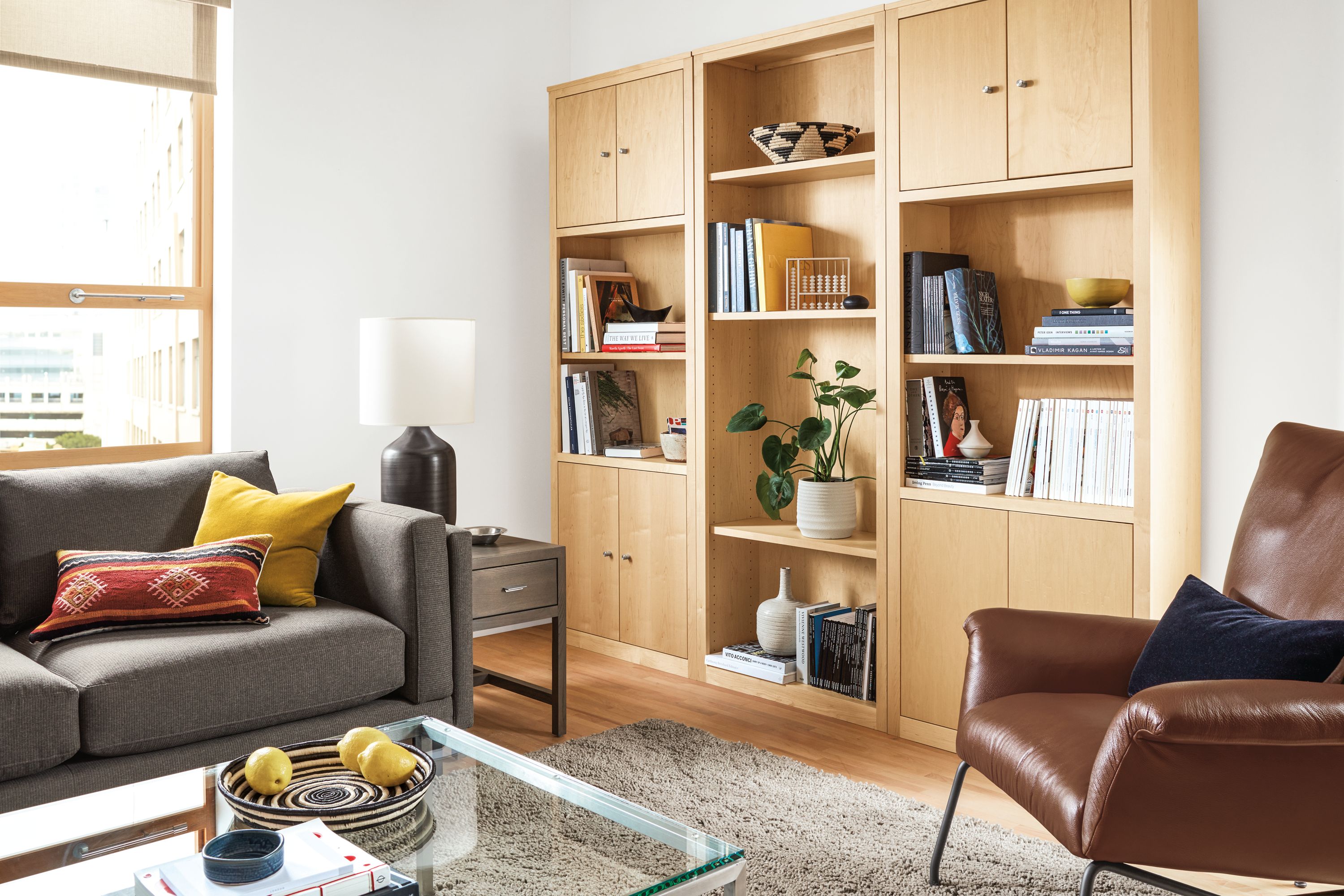 Detail of Woodwind wall unit storage in maple.