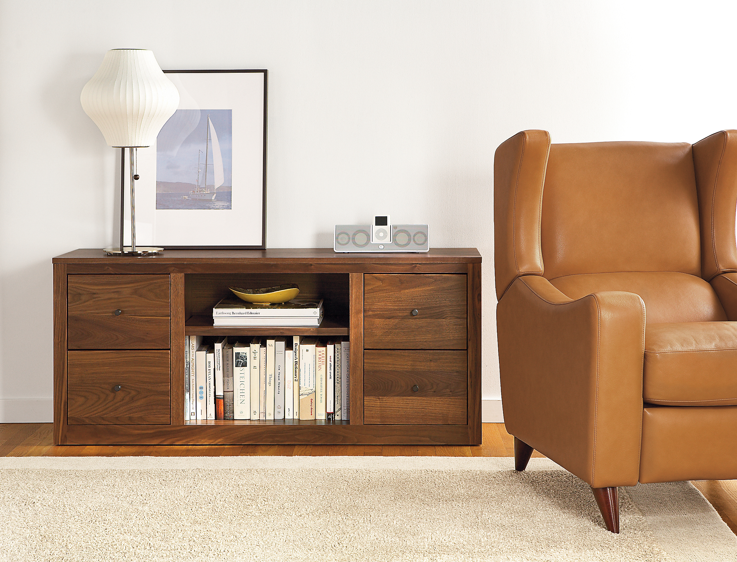 Living room with Woodwind 55-wide Four-Drawer Media Cabinet in Walnut.