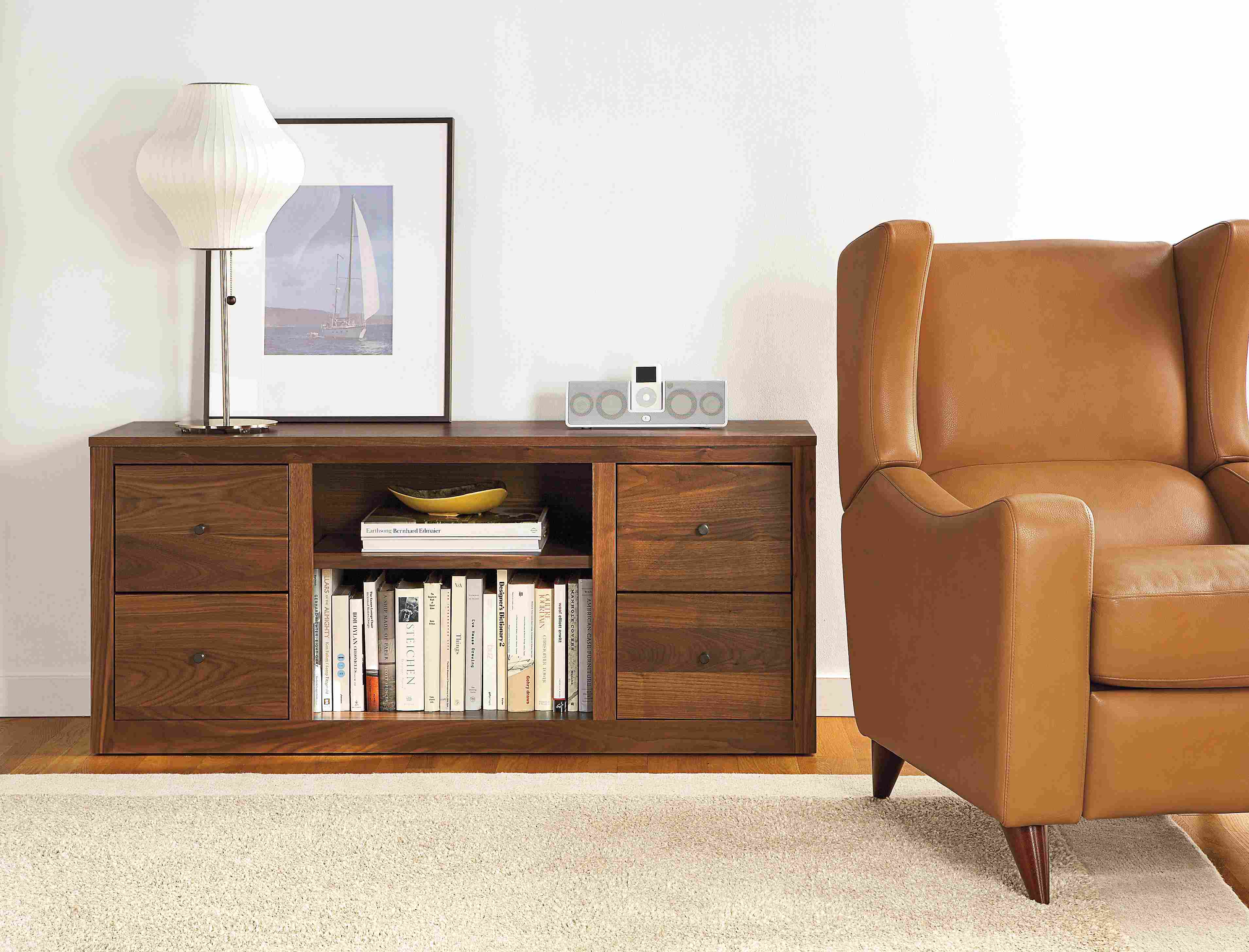 Living room with Woodwind 55-wide 4-Drawer Media Cabinet in Walnut.