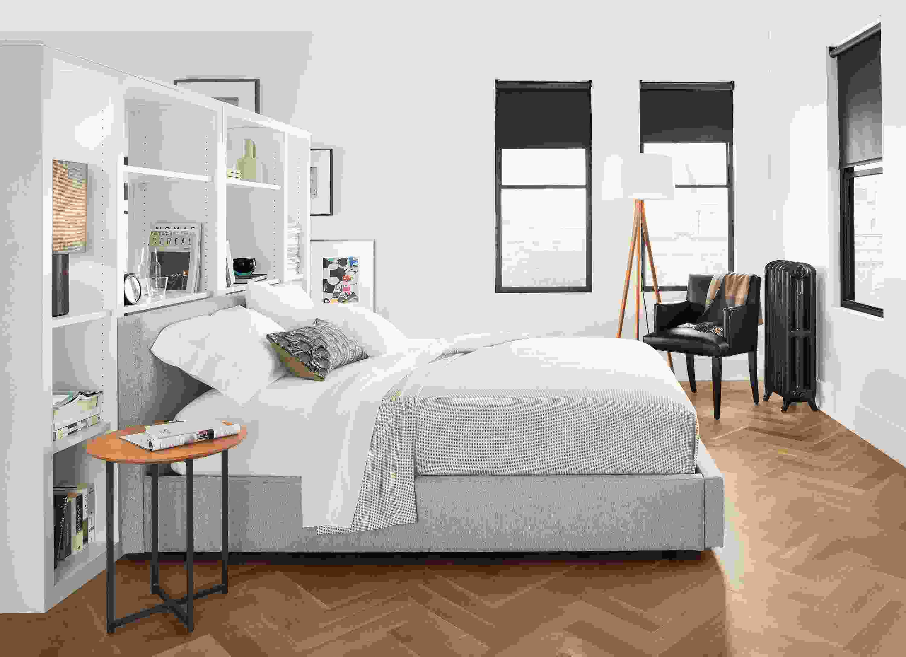 Detail of Wyatt queen bed in boyer grey fabric and Lane floor lamp cherry in bedroom.
