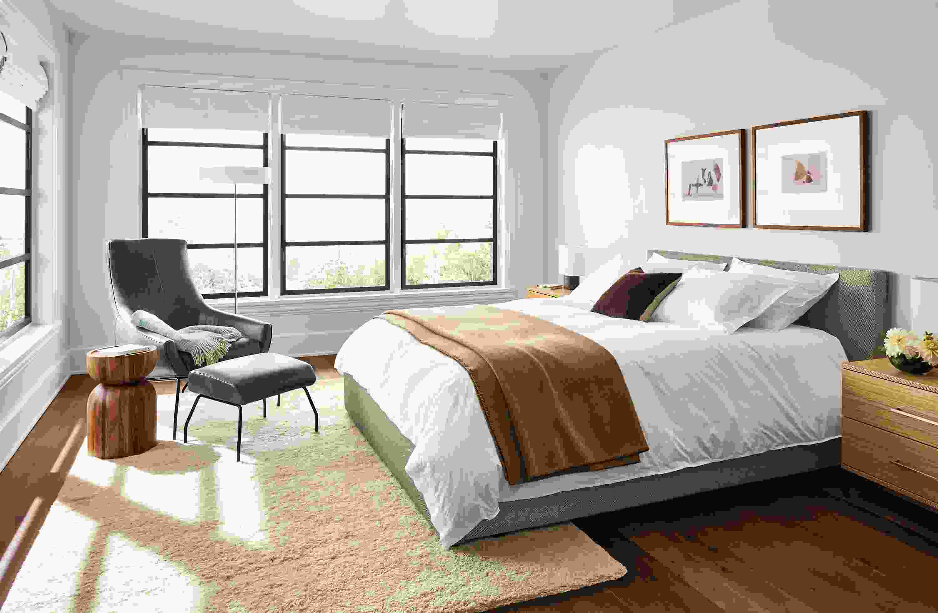 Bedroom with Wyatt queen bed in Arin Grey, Baker nightstands in white oak and Rhodes lounge chair in Vento Smoke.