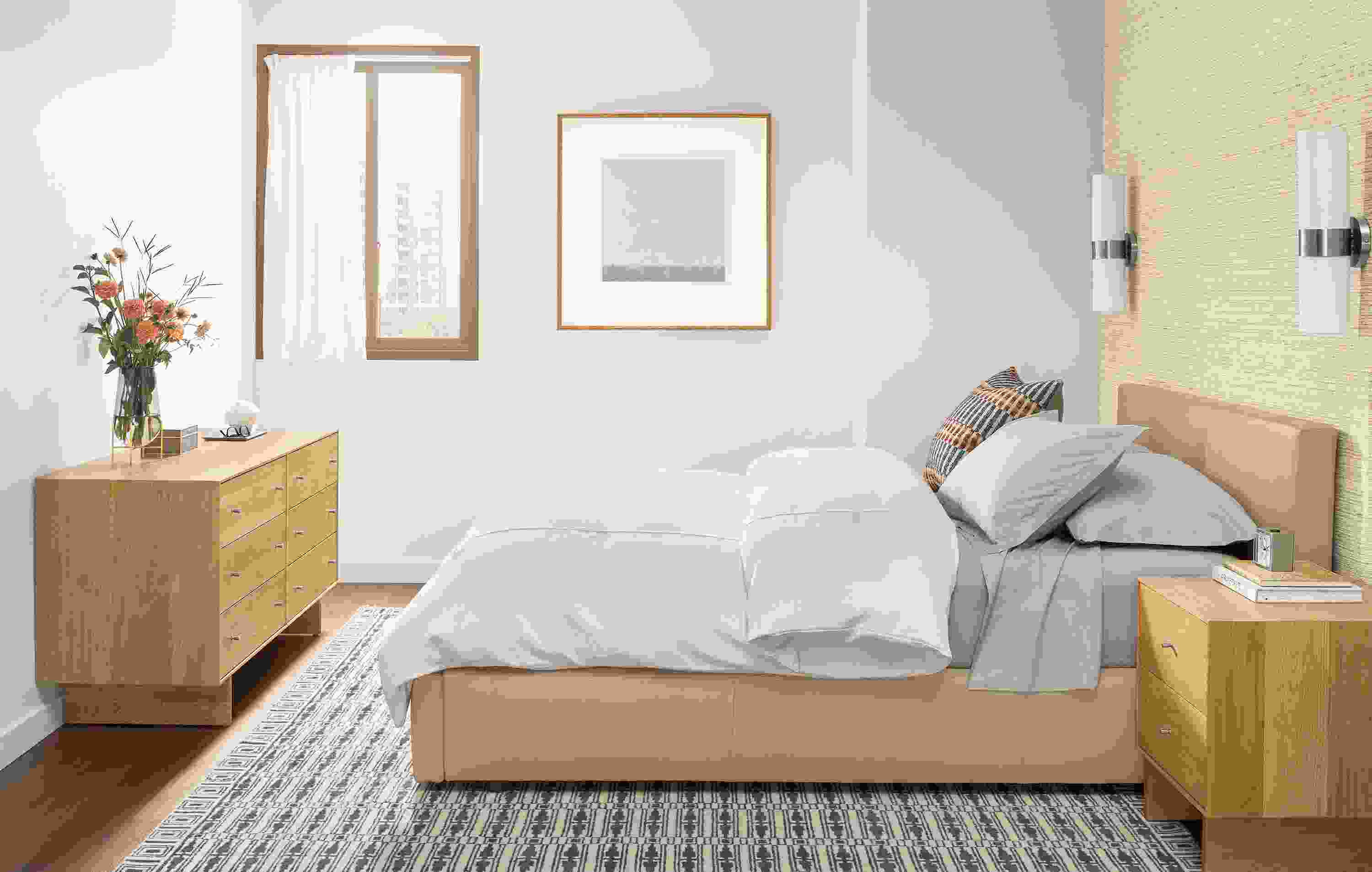 Bedroom with wyatt queen storage bed in fiero camel leather, hudson dresser and nightstand in white oak.