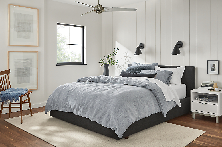 bedroom setting with wyatt queen bed in declan graphite with relaxed linen bedding.