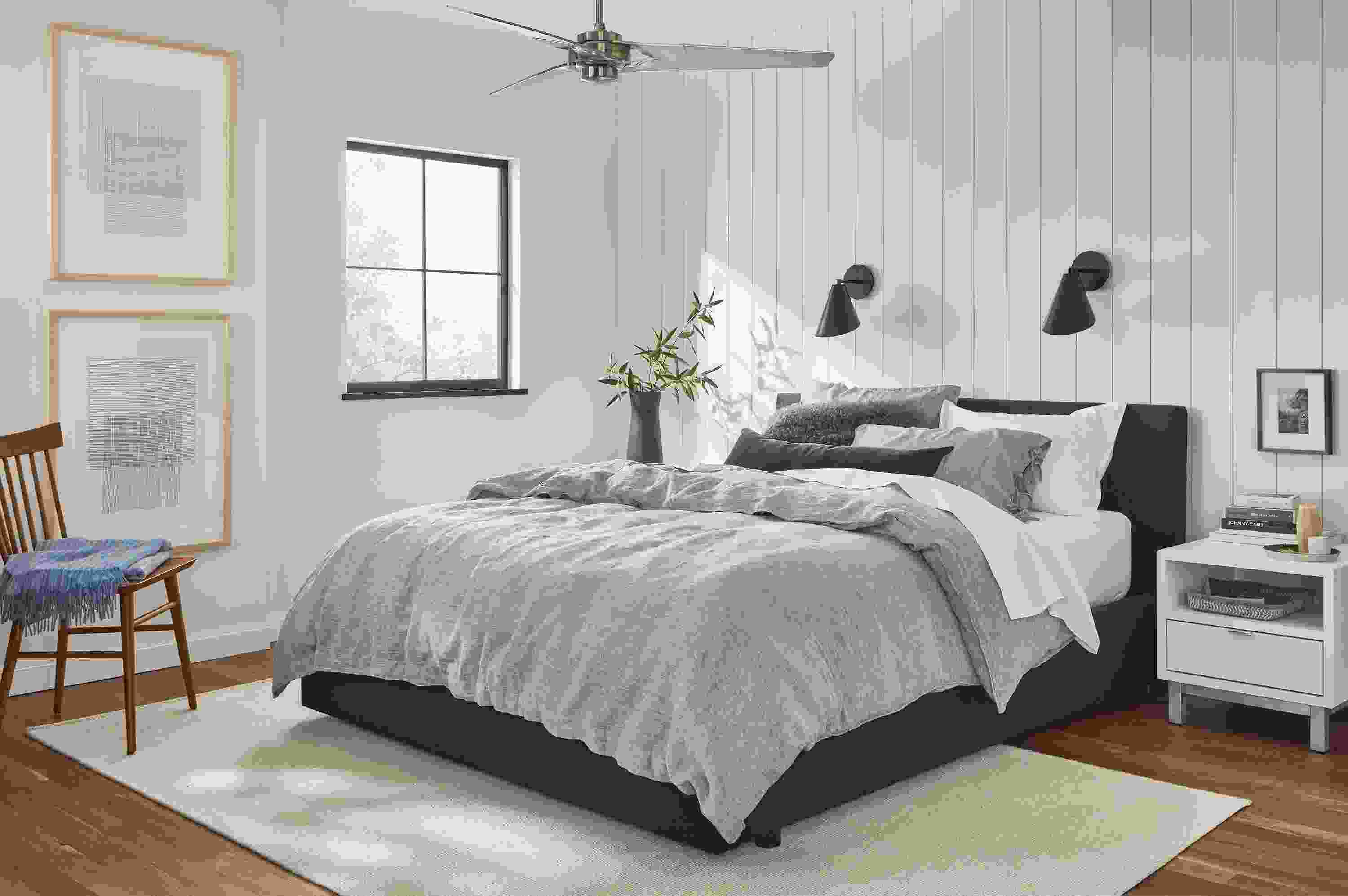 Bedroom with Wyatt queen bed in Declan Graphite with relaxed linen bedding in blue chambray.
