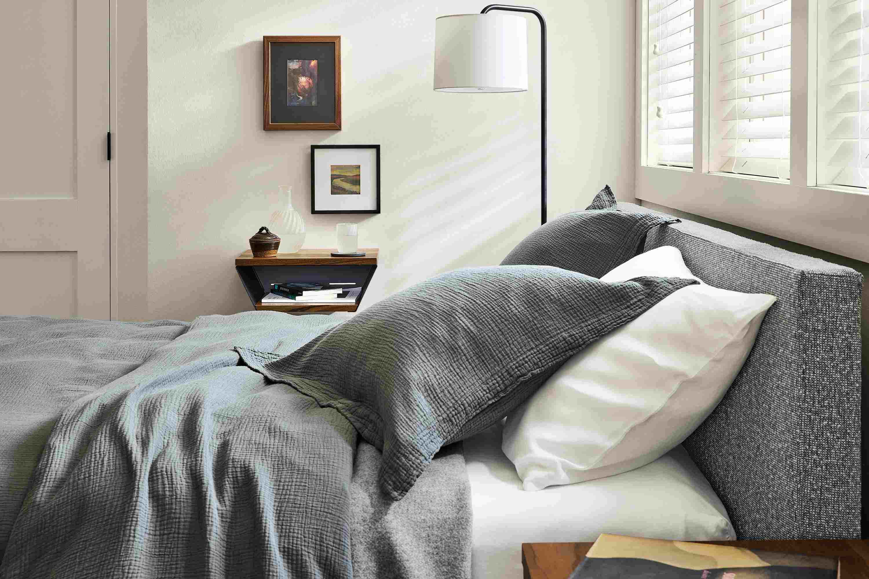 Wyatt queen bed in conley graphite and Alta wall shelf in reclaimed walnut.
