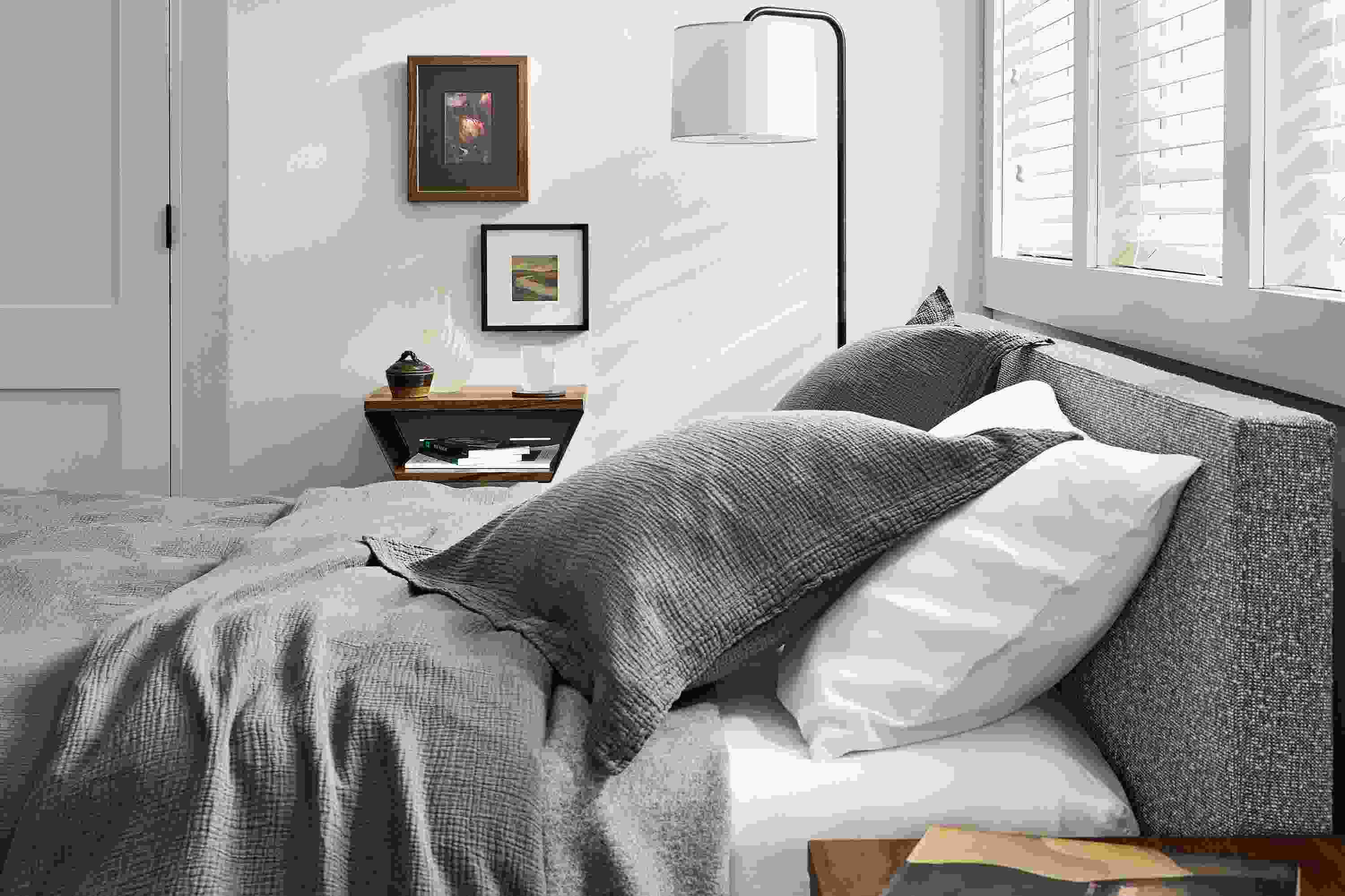 Wyatt queen bed in conley graphite and Alta wall shelf in reclaimed walnut.