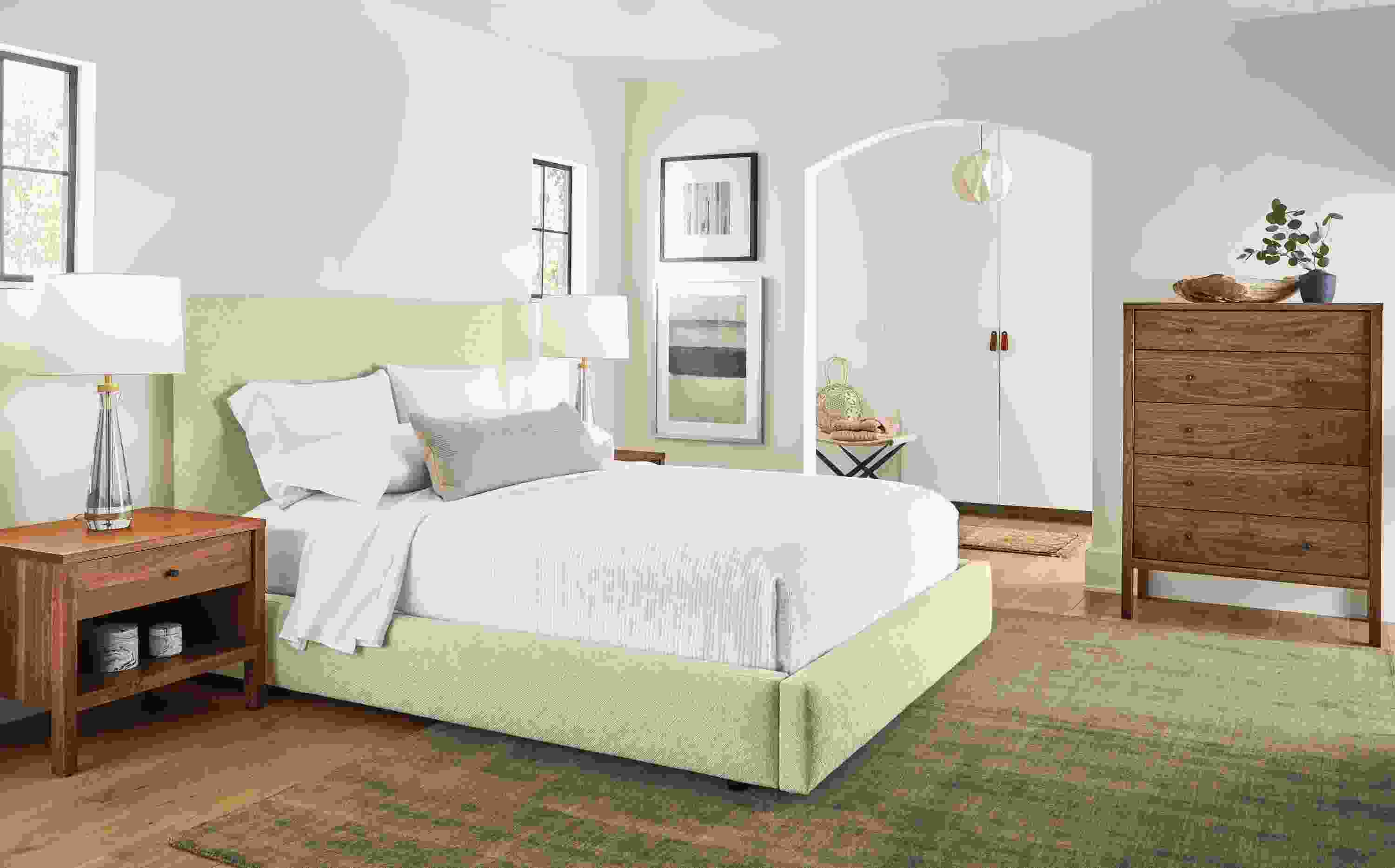 Bedroom with Wyatt queen storage bed in Garret Oatmeal and Emerson dresser and nightstands in walnut.