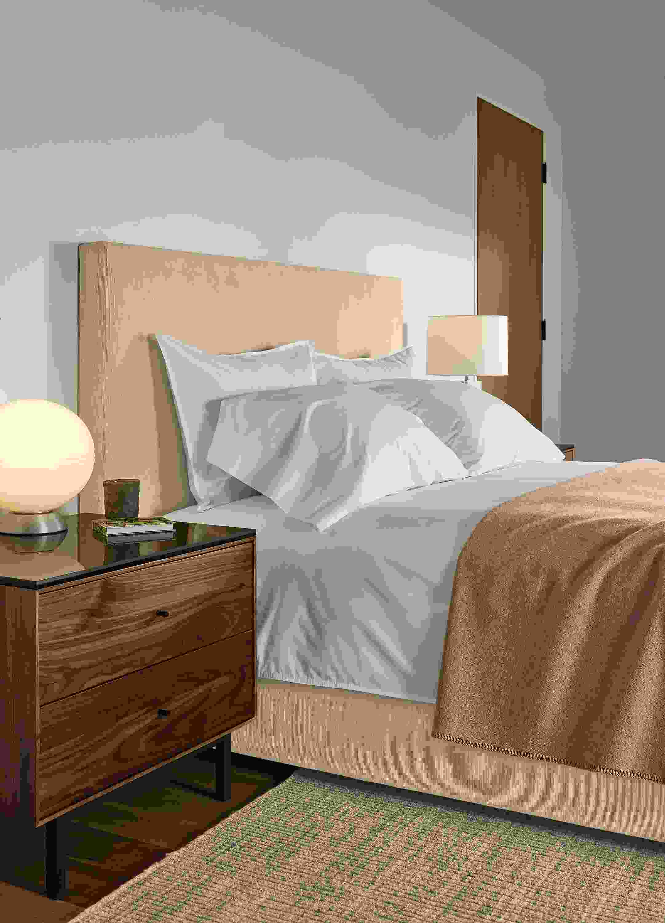 Bedroom with Wyatt queen bed in Nigel Natural and Hudson 2-drawer nightstand in graphite and Marbled black ceramic top.