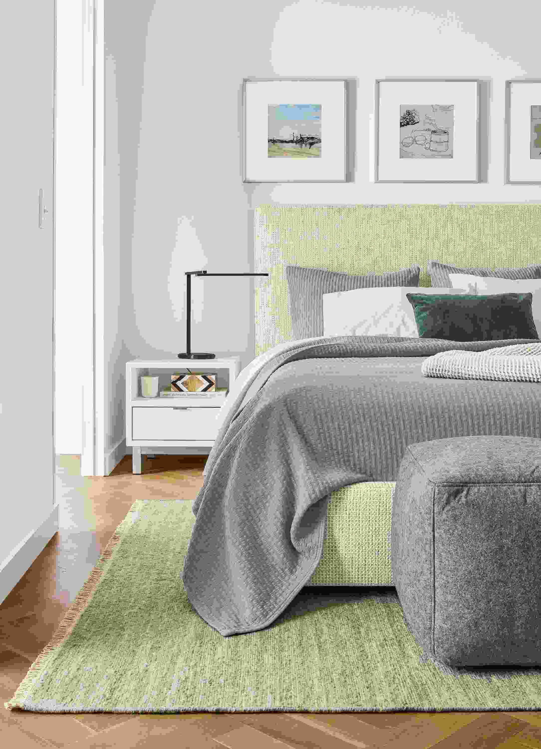 Bedroom with Wyatt queen storage bed in Hearth Oyster fabric and Copenhagen nightstand in white.