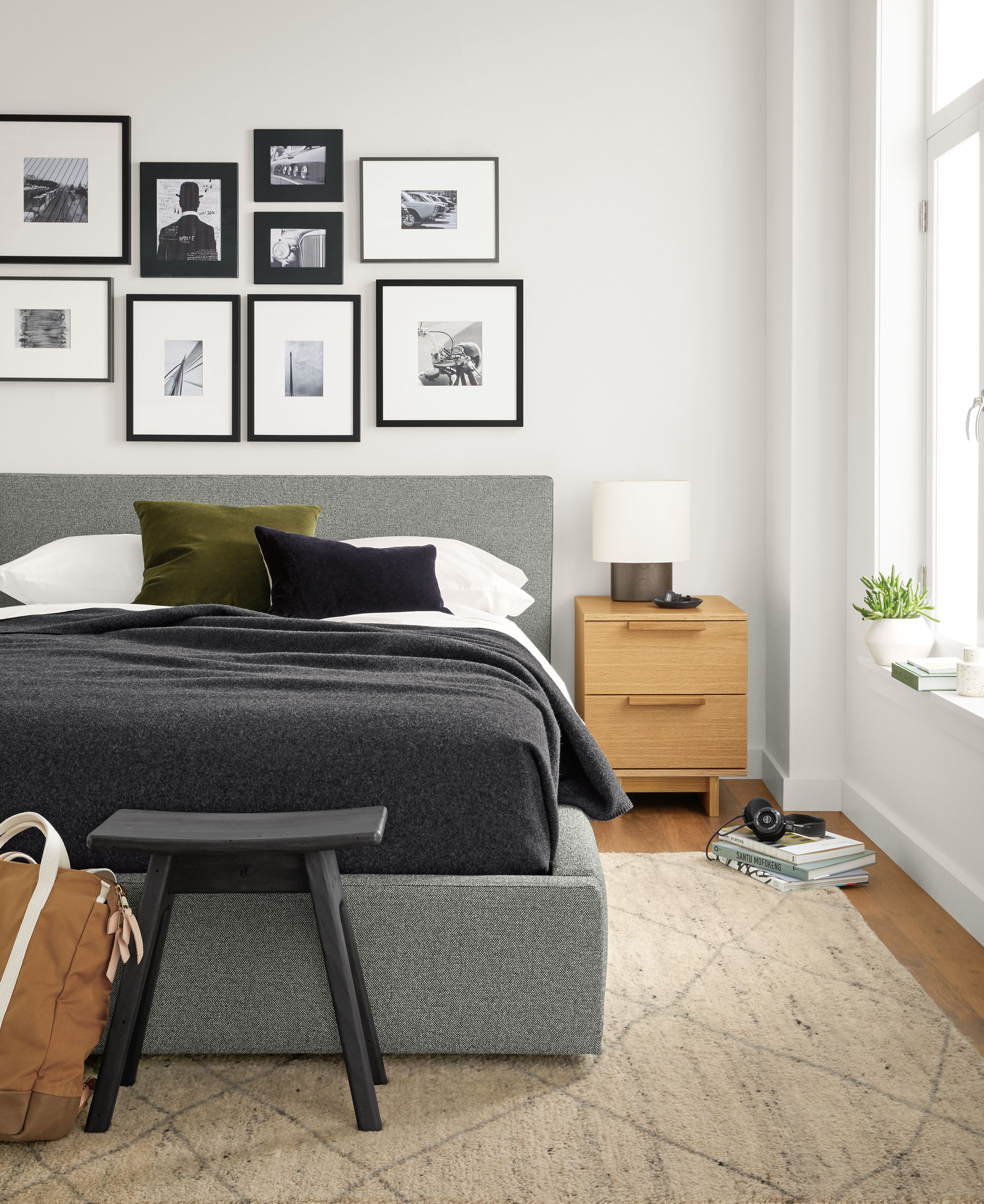 Bedroom with Wyatt queen storage bed in Tatum Spruce and Ashby 2-drawer nightstand in white oak veneer.