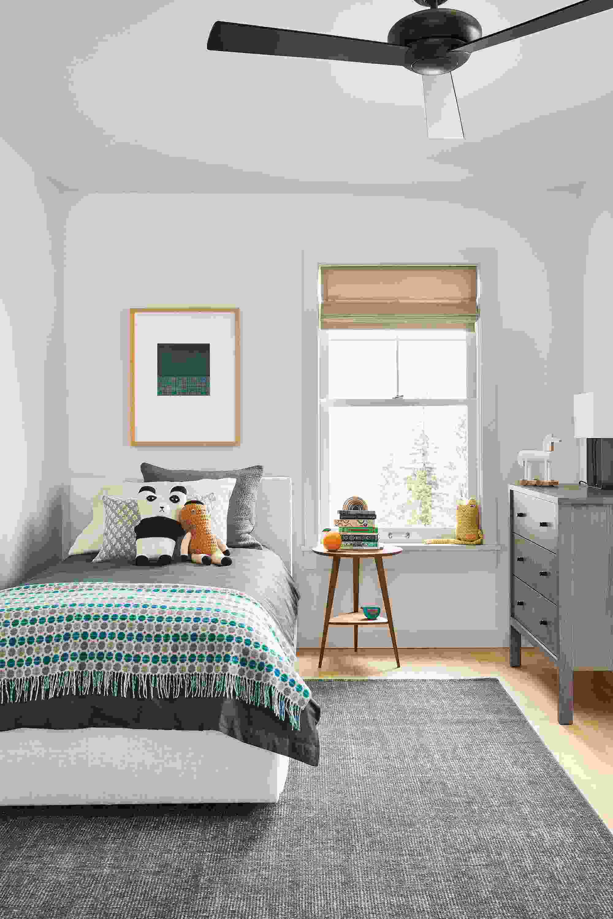 kids bedroom with wyatt twin bed in sumner ivory fabric with blue bedding.