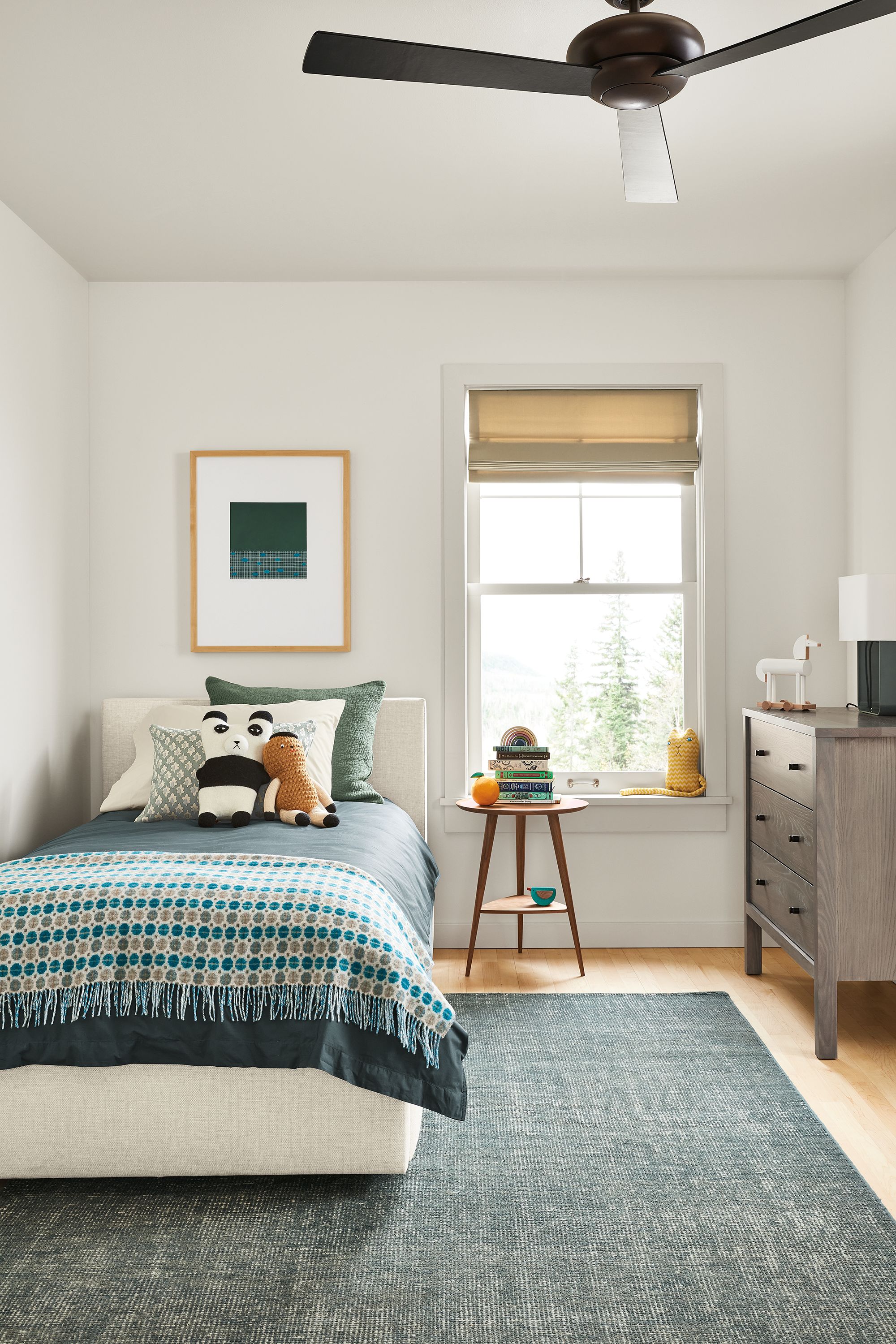 kids bedroom with wyatt twin bed in sumner ivory fabric with blue bedding.