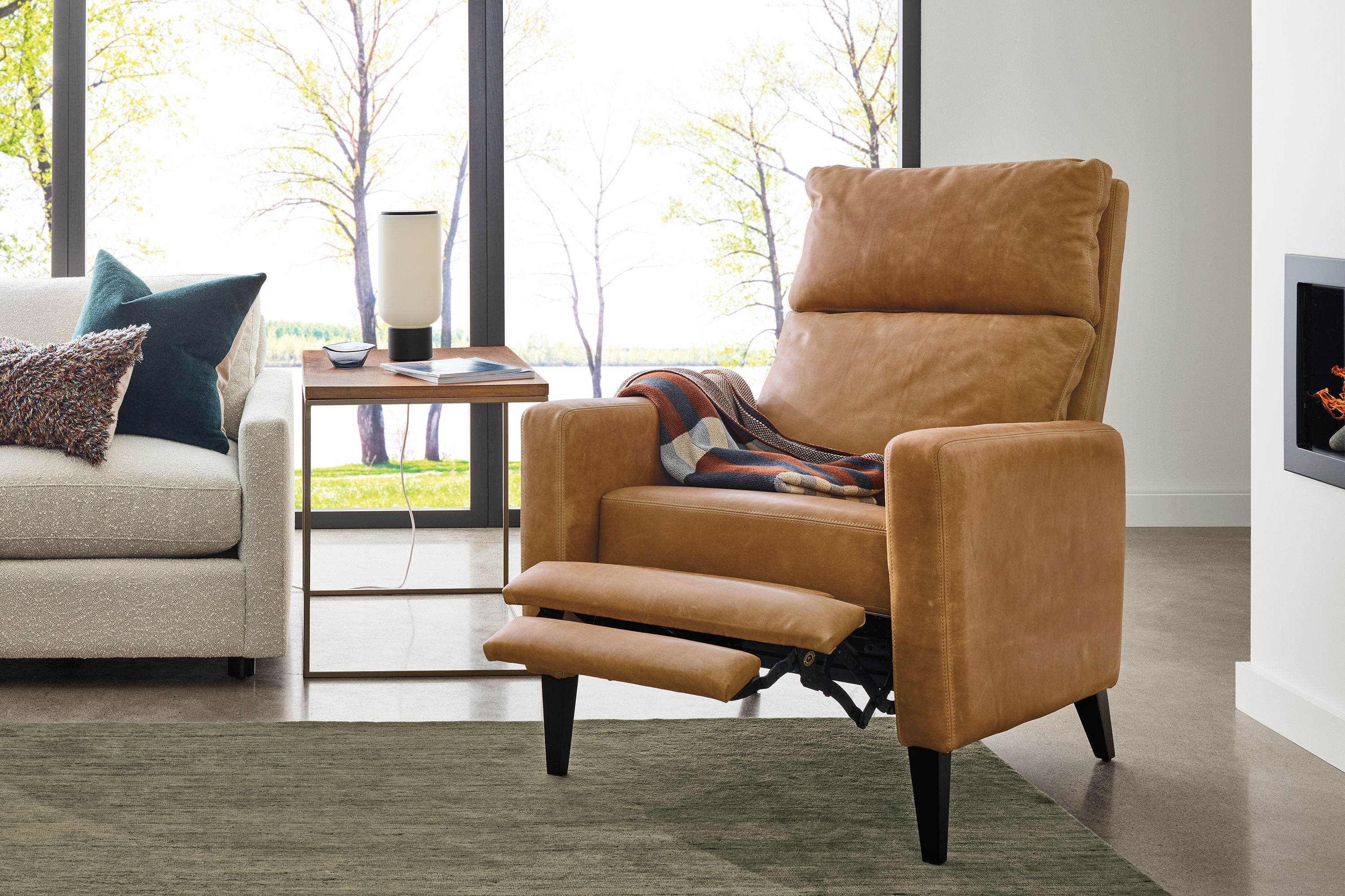 Thin arm recliner in Sarto camel leather with charcoal legs