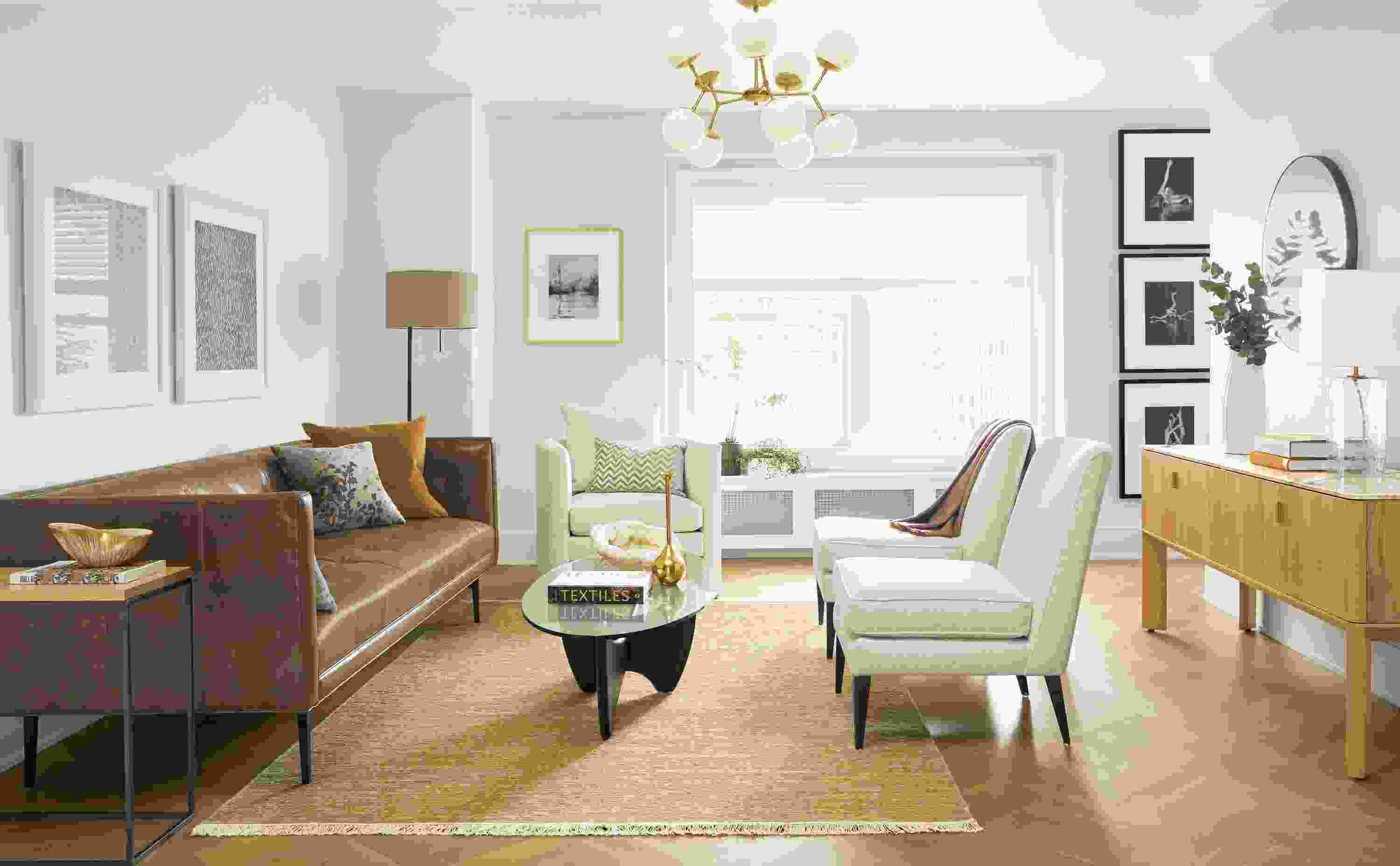 Detail of Wynwood sofa in Vento Pewter leather in living room with Pren console cabinet.