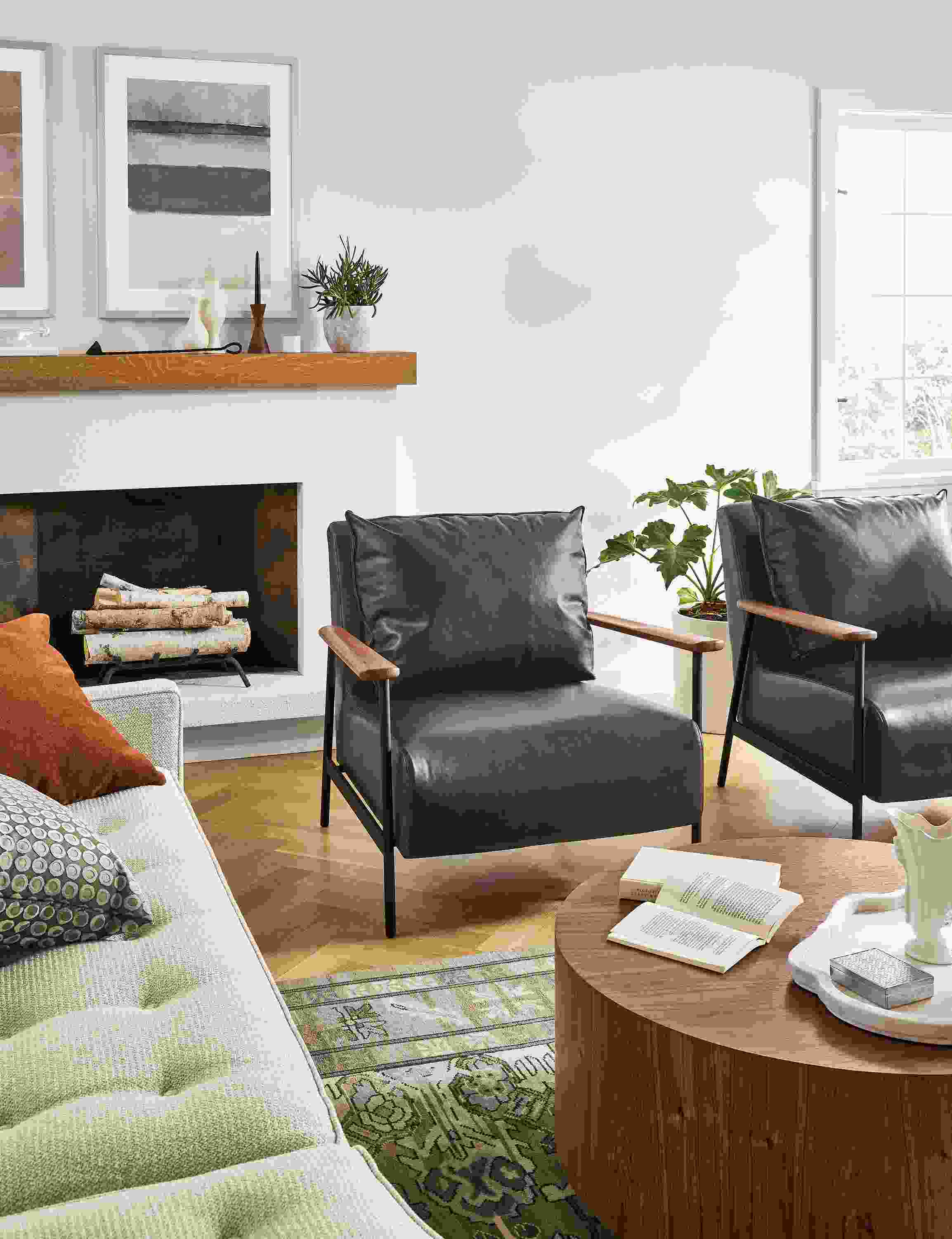 Living room with 2 Xavier chairs in Palermo Charcoal, Liam 36-inch coffee table in walnut, and Reese sofa in Orla Ivory.
