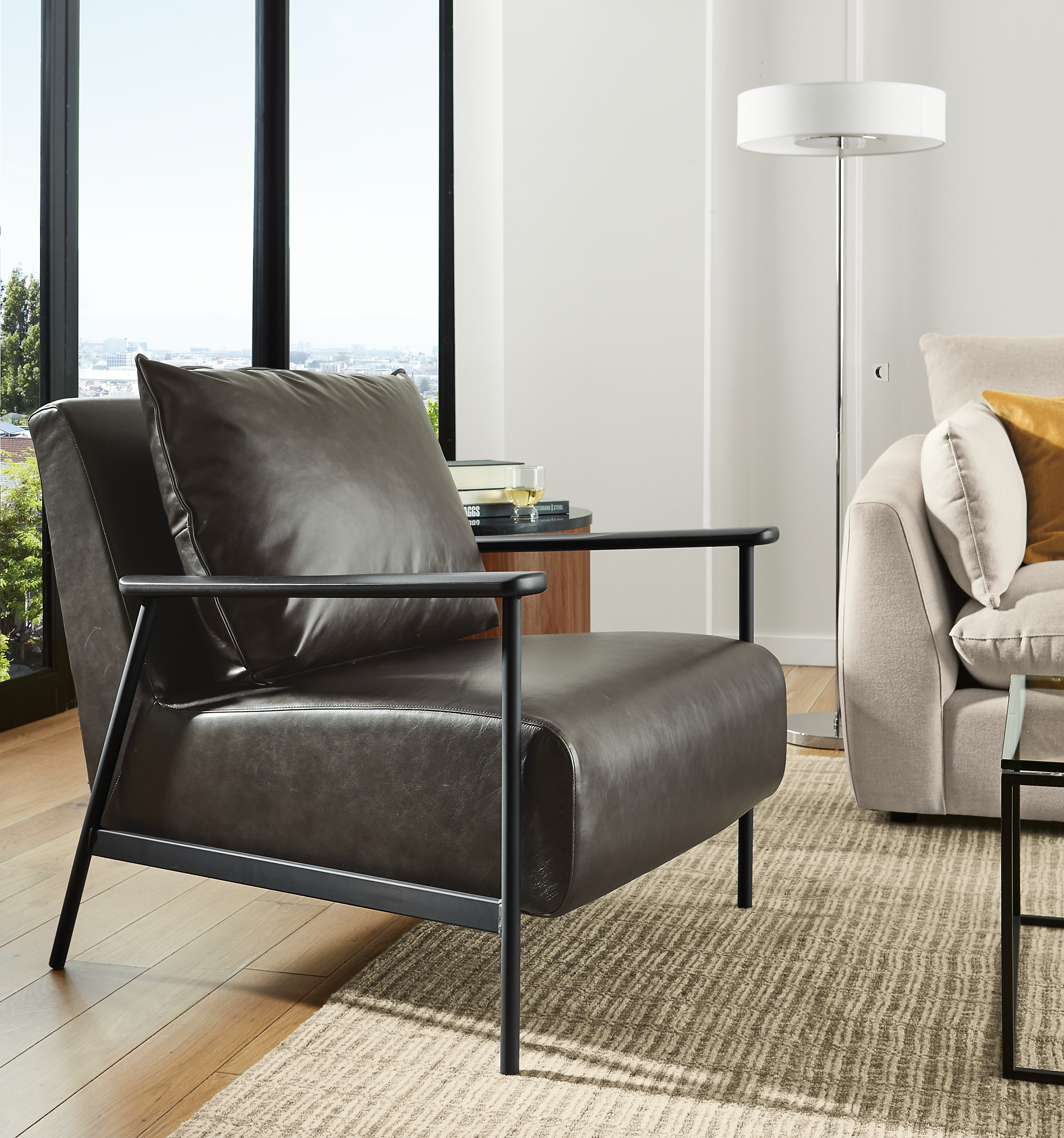 living room with xavier chair in black palermo leather and black steel base.