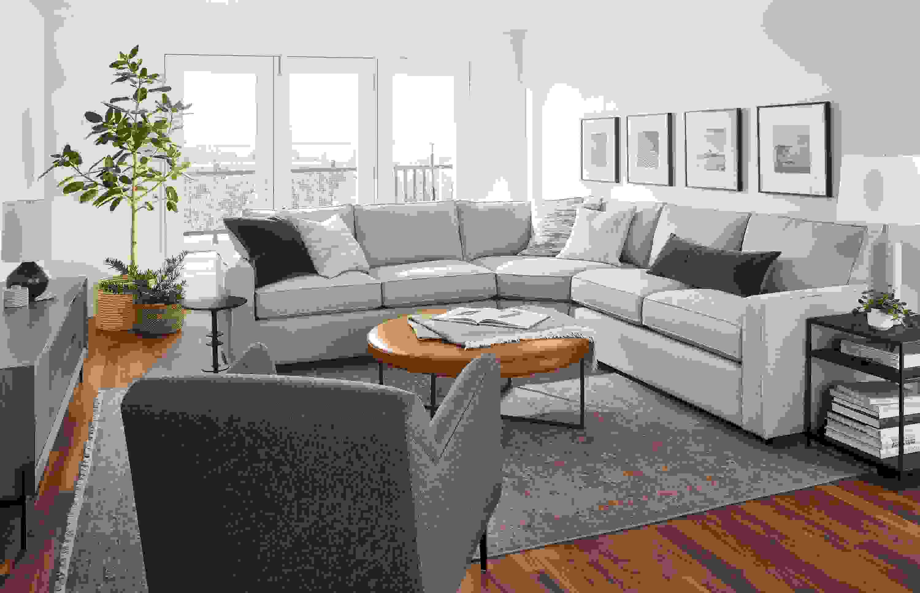 room setting including york 3-piece sectionals, matteo chair, kinley media cabinet, vesuvio rug.