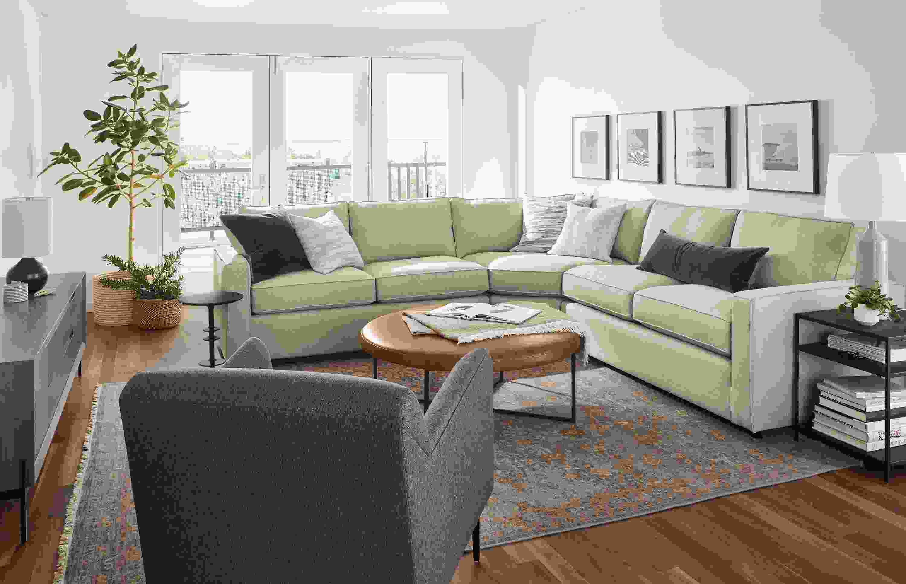 room setting including york 3-piece sectionals, matteo chair, kinley media cabinet, vesuvio rug.