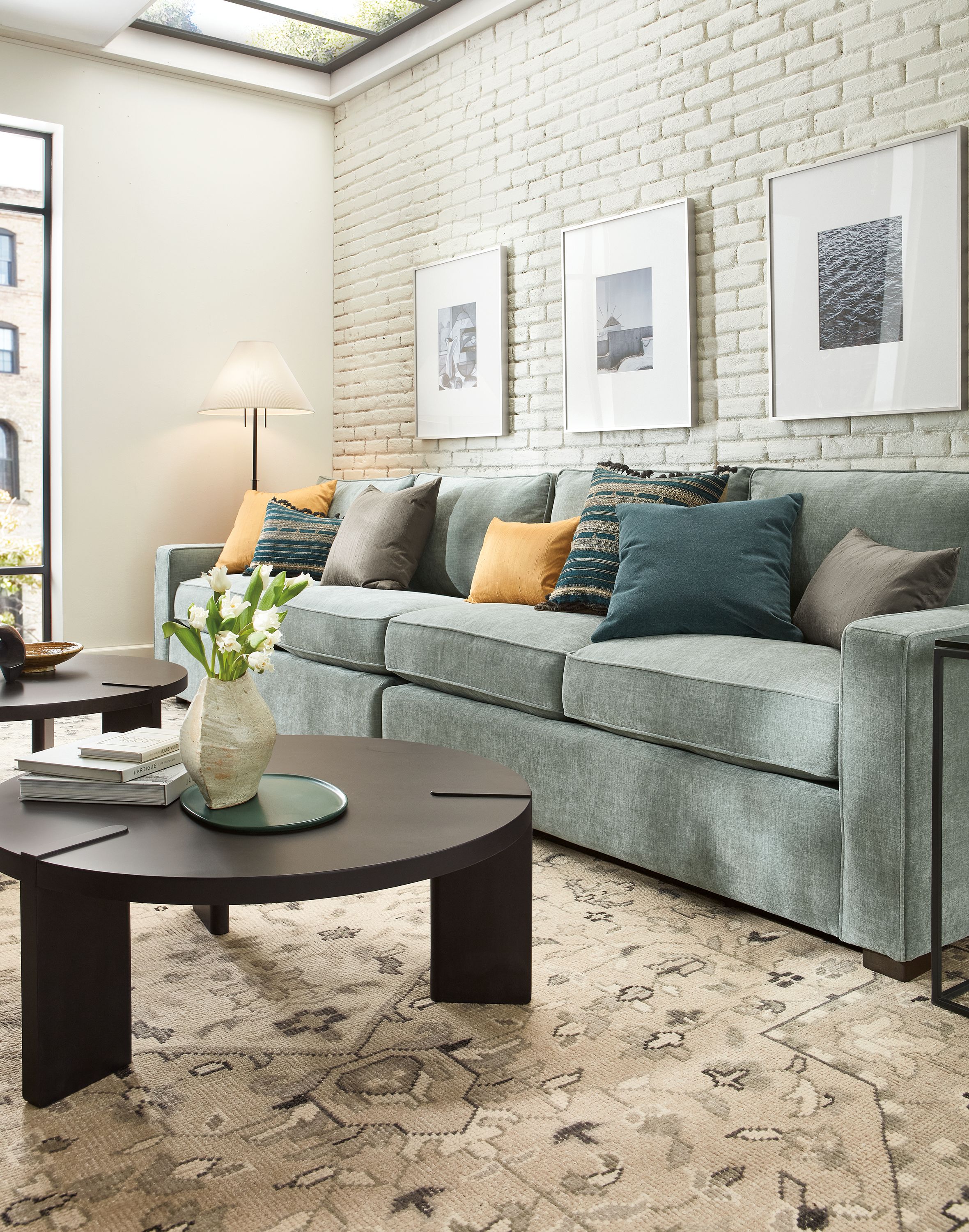 Living room with York sofa in Mori Cloud, Hanover coffee table in charcoal and Veda rug in cement.