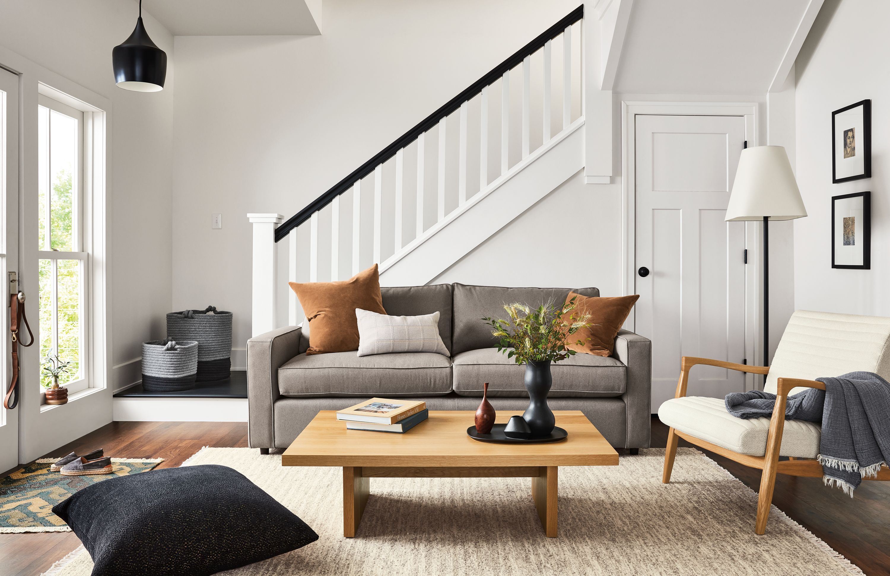 room setting including york 87-wide sofa in dawson cement, callan chair, corbett coffee table, dia rug.