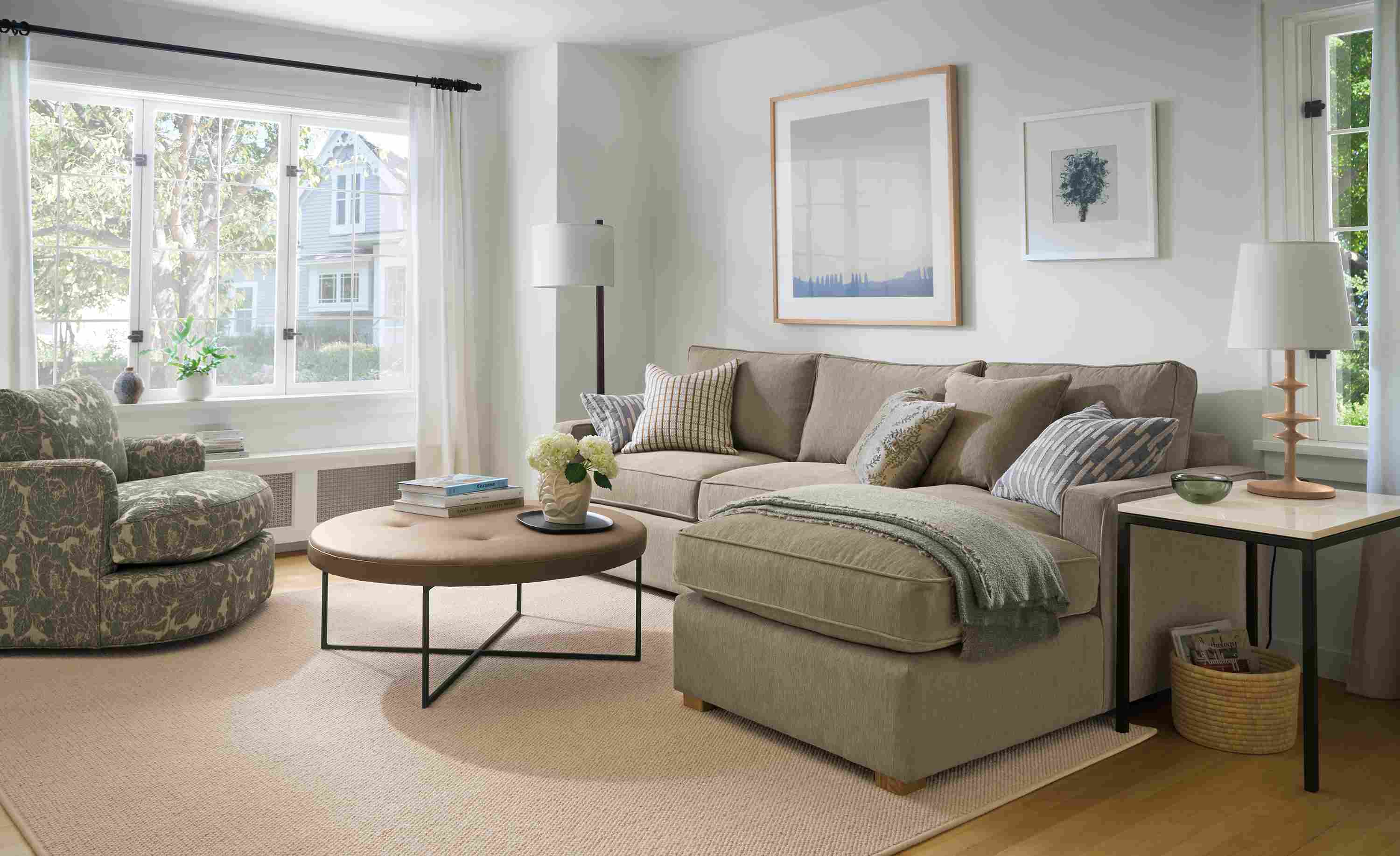 Living room with York sofa in Crawford Putty, Sonja swivel chair in Caldwell Olive and Flannery rug in Oatmeal.