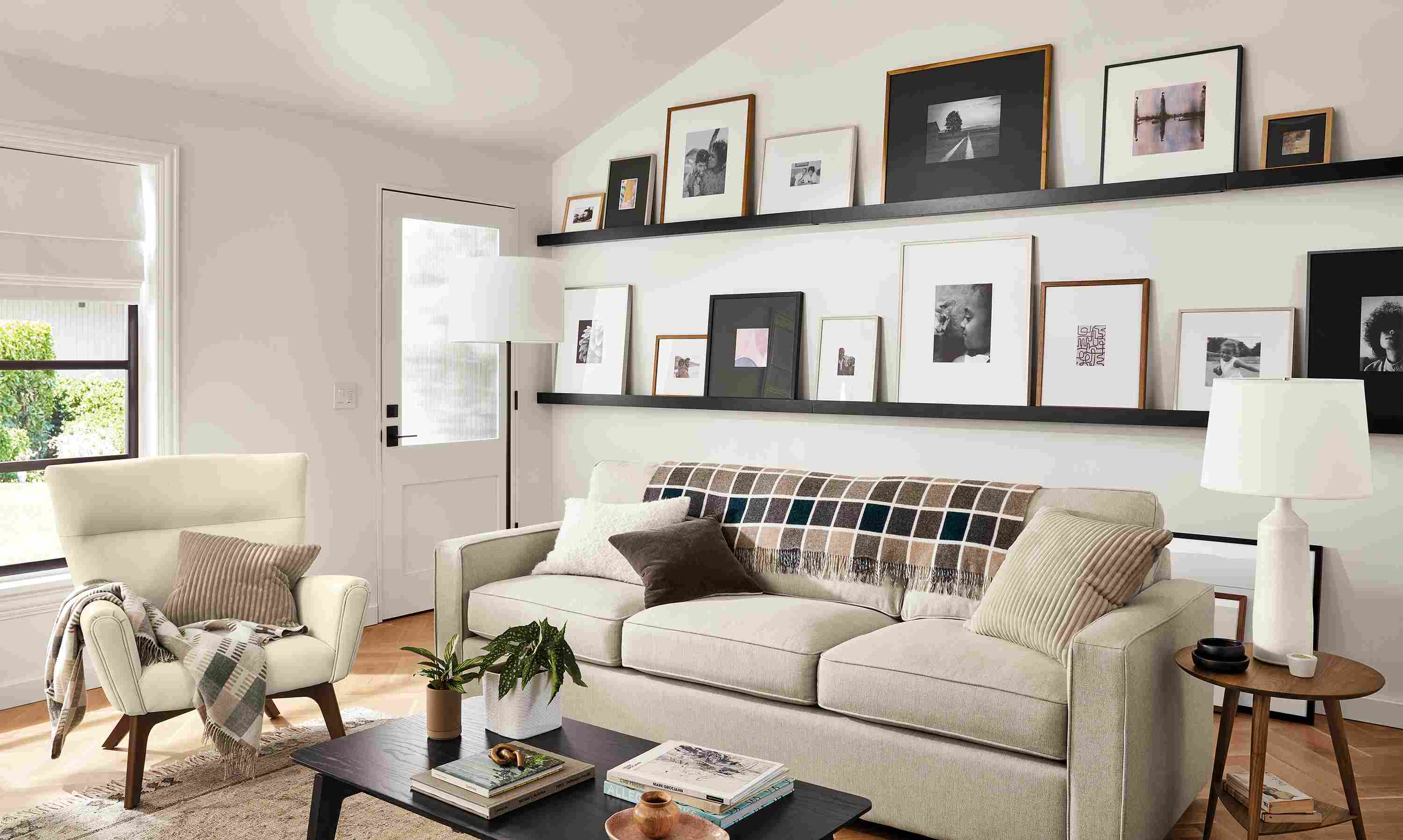 room setting including ayomi yoshida print and parsons table with soren arm chairs.