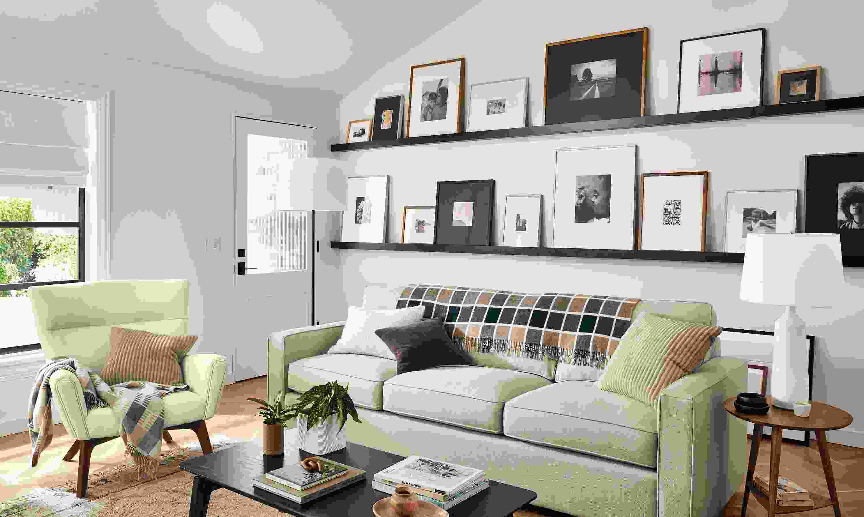 room setting including ayomi yoshida print and parsons table with soren arm chairs.