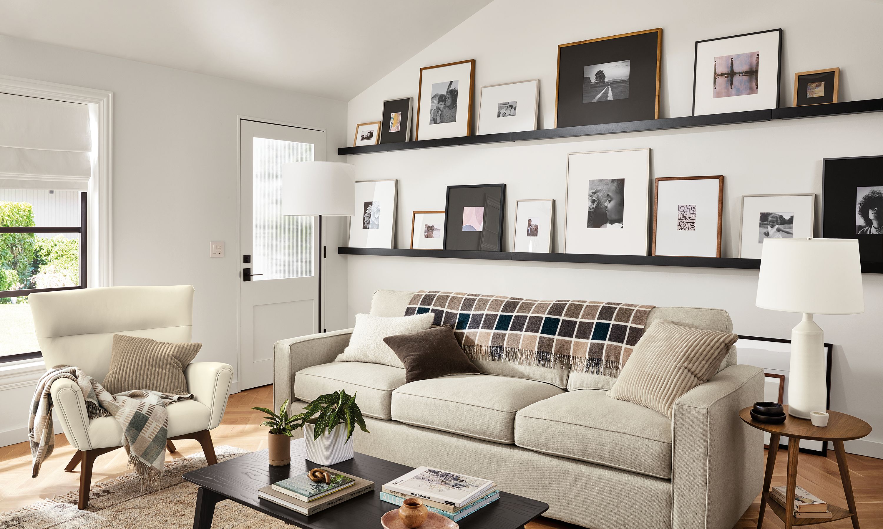 room setting including ayomi yoshida print and parsons table with soren arm chairs.