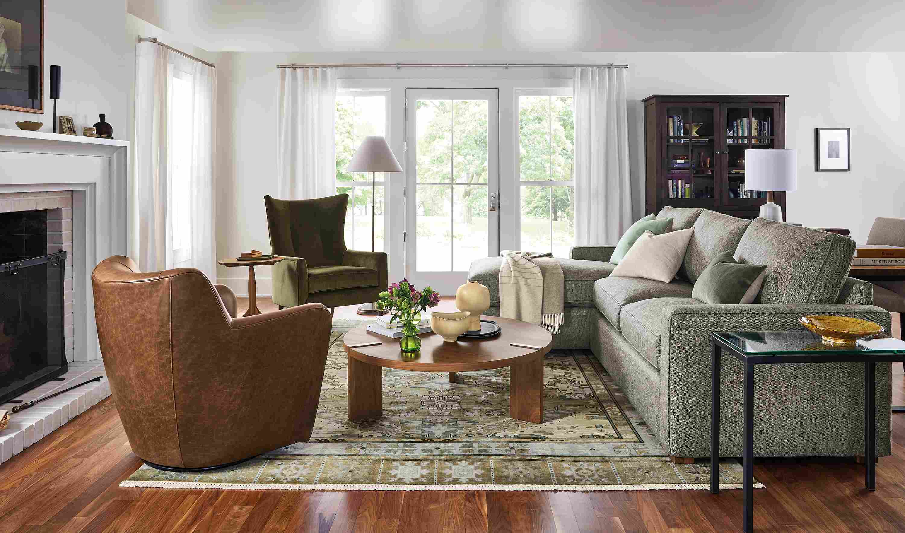 Living area with York sofa-chaise in tepic grey fabric with bradford chair and lily swivel chair.
