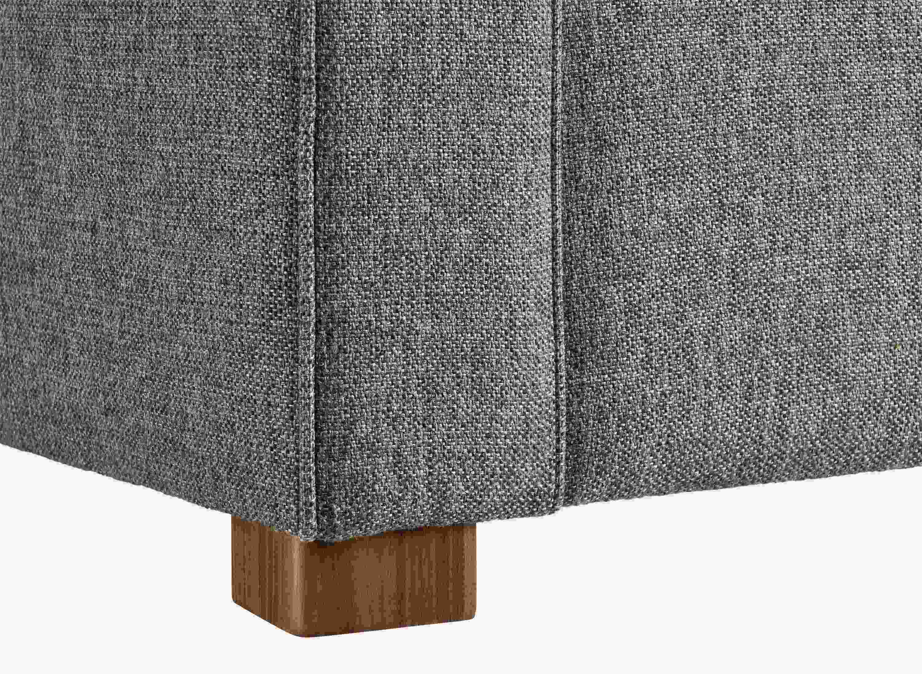 corner detail of the walnut leg on a york sofa.