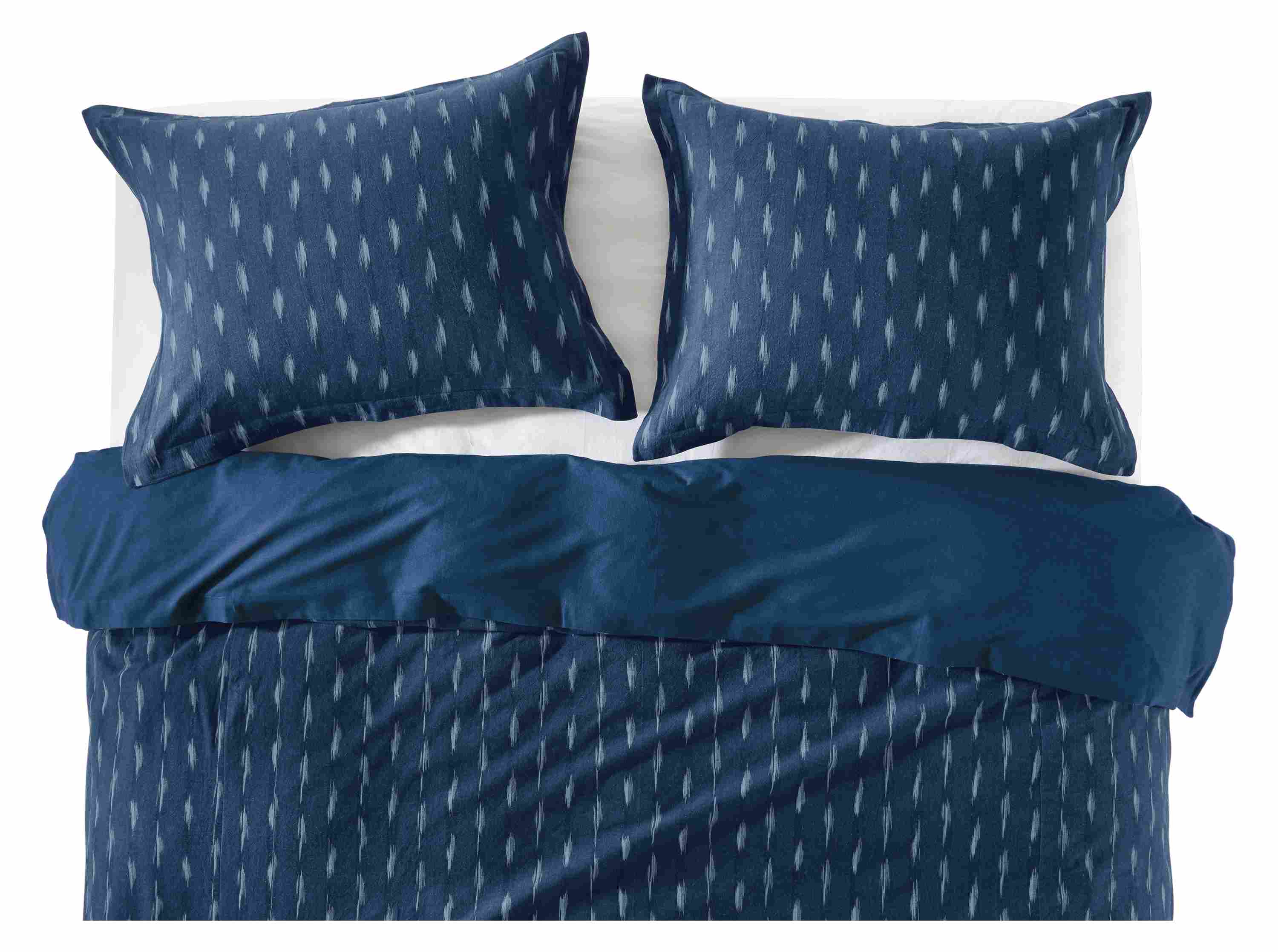 Front of zada duvet cover and shams in indigo on bed.